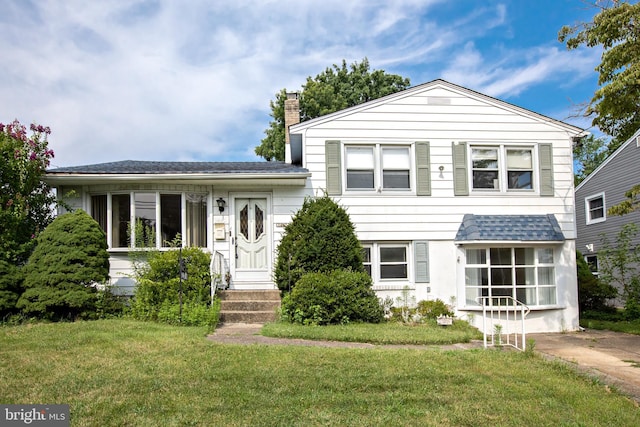 1440 Chestnut Ave, Gloucester City, NJ 08030 - split level home featuring a front yard and a chimney
