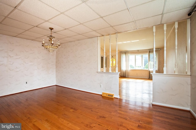 1440 Chestnut Ave, Gloucester City, NJ 08030 - spare room with a drop ceiling, hardwood / wood-style floors, and a chandelier