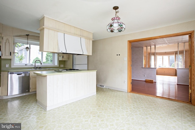1440 Chestnut Ave, Gloucester City, NJ 08030 - kitchen featuring stainless steel dishwasher, freestanding refrigerator, plenty of natural light, wallpapered walls, and crown molding