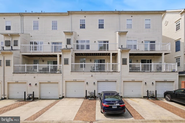 622 Main St Unit 622B, Gaithersburg, MD 20878 - rear view of property featuring a garage and driveway