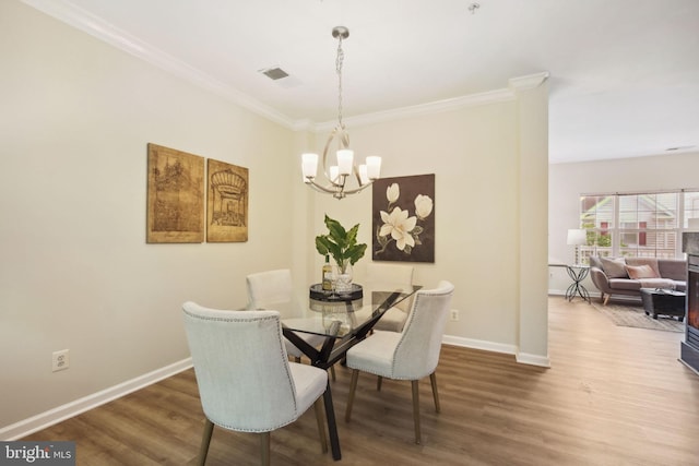 622 Main St Unit 622B, Gaithersburg, MD 20878 - dining area with a chandelier, wood finished floors, and crown molding