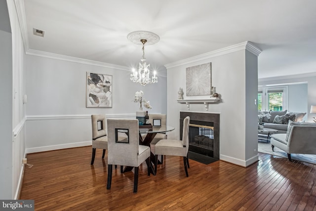 3818 White Post Ct, Alexandria, VA 22304 - dining room with hardwood / wood-style flooring, ornamental molding, a chandelier, and a multi sided fireplace