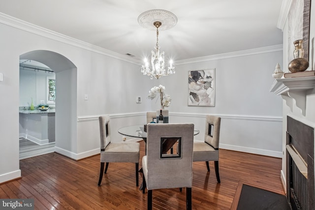 3818 White Post Ct, Alexandria, VA 22304 - dining room featuring hardwood / wood-style flooring, ornamental molding, arched walkways, and a chandelier