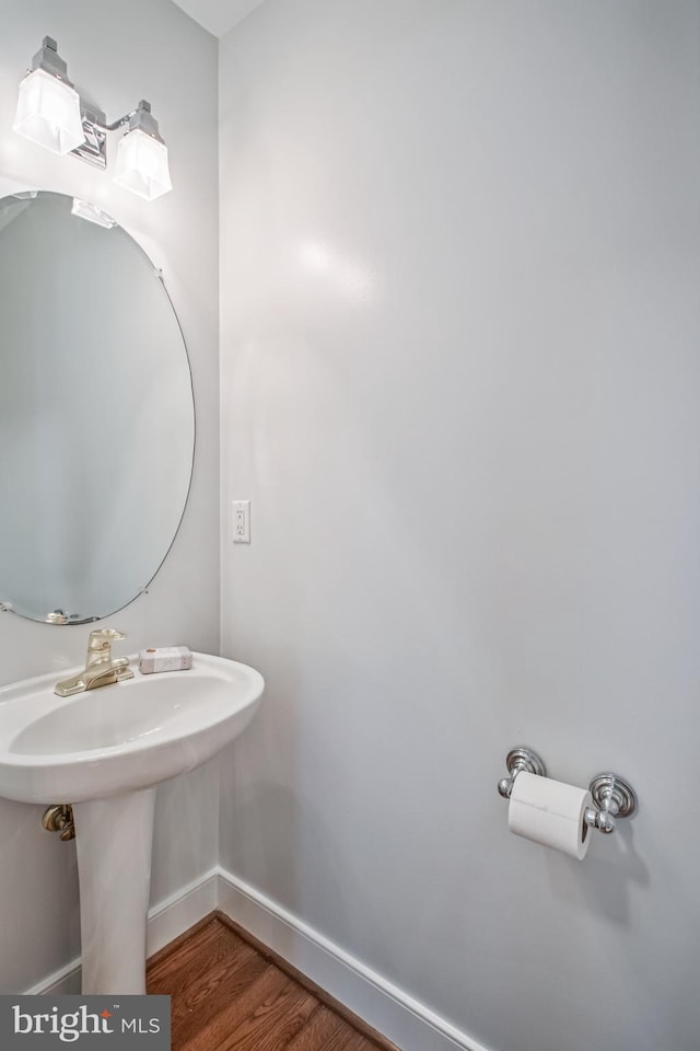 3818 White Post Ct, Alexandria, VA 22304 - bathroom featuring baseboards and wood finished floors