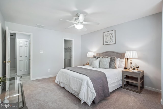 3818 White Post Ct, Alexandria, VA 22304 - carpeted bedroom with a walk in closet, a ceiling fan, and a closet