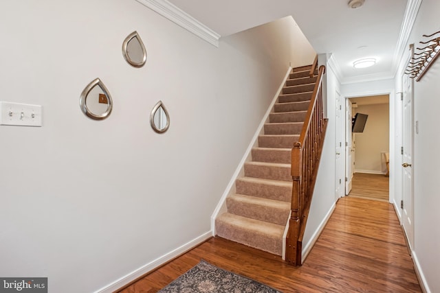 3818 White Post Ct, Alexandria, VA 22304 - stairway with crown molding and wood finished floors