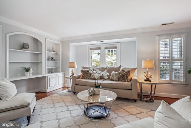 3818 White Post Ct, Alexandria, VA 22304 - living area featuring ornamental molding, plenty of natural light, built in shelves, and wood finished floors