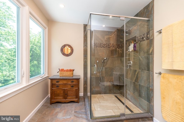 760 Audubon Dr, North Wales, PA 19454 - bathroom with plenty of natural light, a shower stall, recessed lighting, and stone finish floors