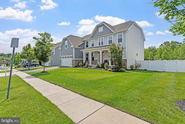 29 Carrington Way, Marlton, NJ 08053 - view of front facade featuring an attached garage, covered porch, stone siding, and asphalt driveway