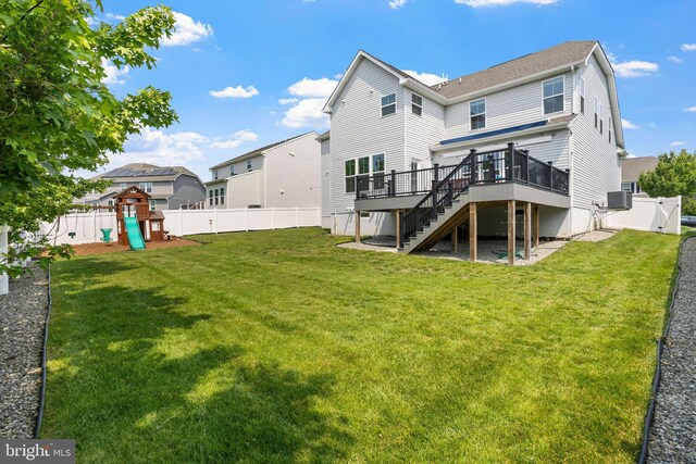 29 Carrington Way, Marlton, NJ 08053 - back of house with stairs, a wooden deck, a fenced backyard, and a playground