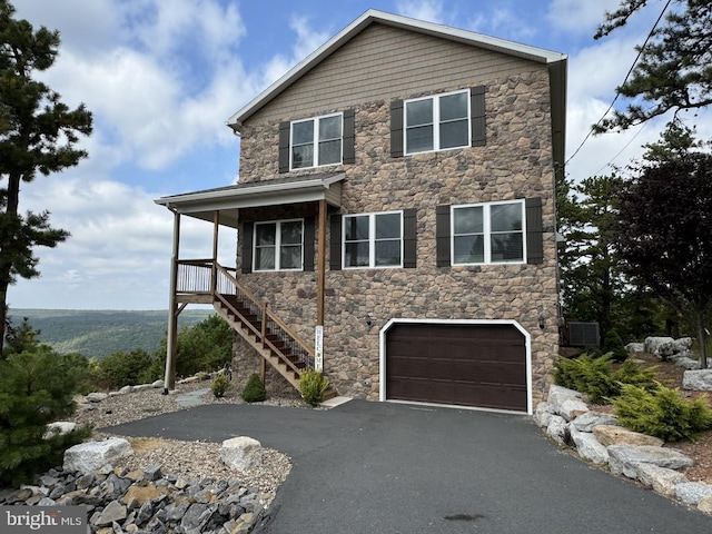 532 Buck Mountain Blvd, Hazle Township, PA 18202 - view of front of home featuring stone siding, an attached garage, driveway, and stairs