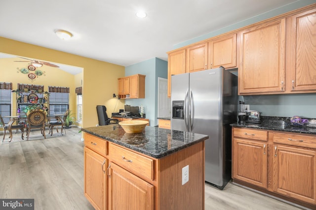 1 Fletcher Dr, Fredericksburg, VA 22406 - kitchen featuring stainless steel fridge with ice dispenser, a center island, light wood-style flooring, and dark stone countertops