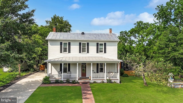 12353 Barbee Rd, Bristow, VA 20136 - view of front of home with a porch, a metal roof, a chimney, a standing seam roof, and a front lawn