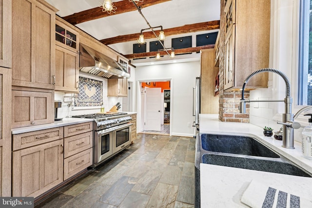12353 Barbee Rd, Bristow, VA 20136 - kitchen with double oven range, tasteful backsplash, light countertops, beamed ceiling, and wall chimney range hood