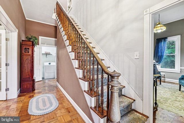 12353 Barbee Rd, Bristow, VA 20136 - stairway featuring washer / clothes dryer and crown molding