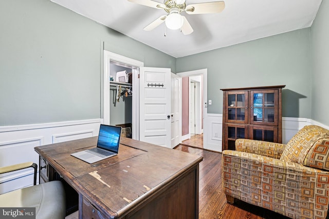 12353 Barbee Rd, Bristow, VA 20136 - home office featuring wainscoting, dark wood-style flooring, and a ceiling fan