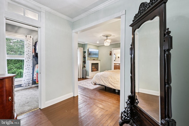12353 Barbee Rd, Bristow, VA 20136 - bedroom featuring dark wood-style floors, ornamental molding, a fireplace, and radiator