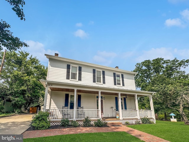 12353 Barbee Rd, Bristow, VA 20136 - view of front of property with a porch, a chimney, and a front yard