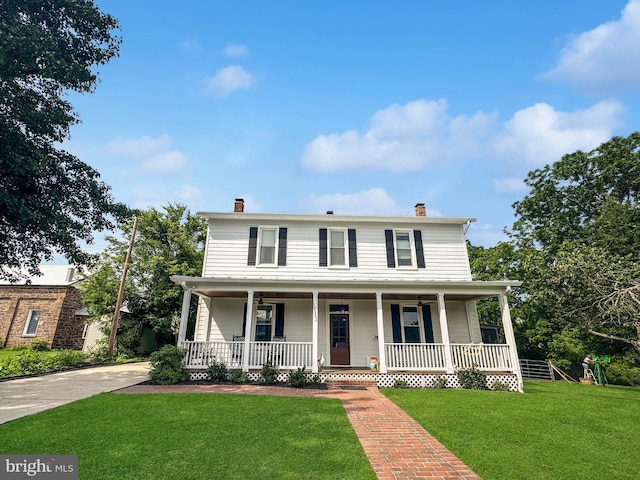 12353 Barbee Rd, Bristow, VA 20136 - view of front of property featuring covered porch, a chimney, and a front yard