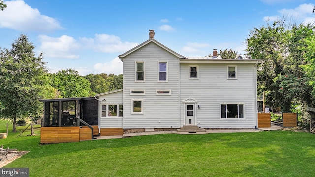 12353 Barbee Rd, Bristow, VA 20136 - back of property with entry steps, a chimney, and a sunroom