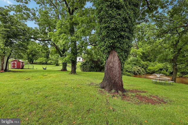 12353 Barbee Rd, Bristow, VA 20136 - view of green lawn with a storage shed