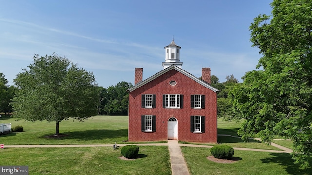 12353 Barbee Rd, Bristow, VA 20136 - exterior space with a chimney, brick siding, and a front yard