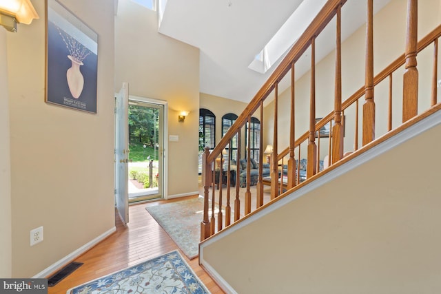 10112 Collington Campus Dr Unit 7, Bowie, MD 20721 - entrance foyer featuring stairs, wood finished floors, a high ceiling, and a skylight