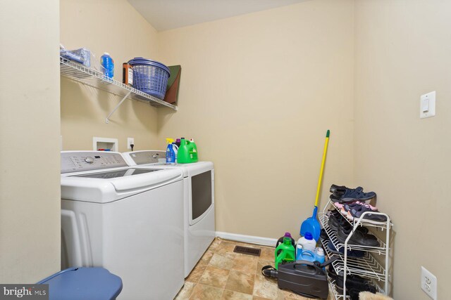 10112 Collington Campus Dr Unit 7, Bowie, MD 20721 - laundry room with washer and dryer and light stone finish floors