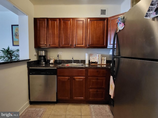 224 W Rittenhouse Sq Unit 3118, Philadelphia, PA 19103 - kitchen with appliances with stainless steel finishes, dark countertops, and light tile patterned floors