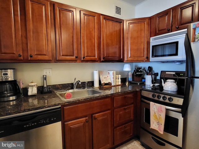 224 W Rittenhouse Sq Unit 3118, Philadelphia, PA 19103 - kitchen with stainless steel appliances and dark stone countertops