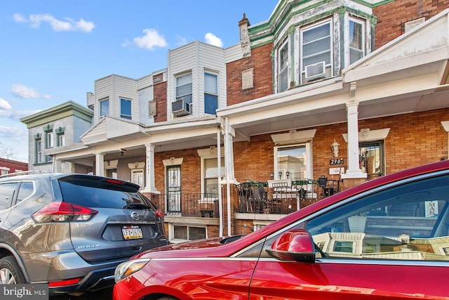 2904 N Taney St, Philadelphia, PA 19132 - view of side of home with brick siding, covered porch, and cooling unit