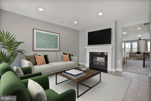 1220 Main Line Blvd Unit 102, Alexandria, VA 22301 - living area with recessed lighting, a glass covered fireplace, light tile patterned flooring, and light colored carpet