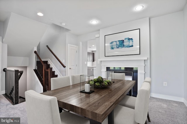 1220 Main Line Blvd Unit 102, Alexandria, VA 22301 - carpeted dining space featuring stairway, a fireplace, and recessed lighting
