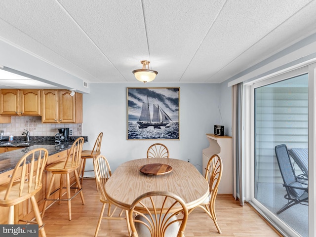 107 Convention Center Dr Unit 1410D, Ocean City, MD 21842 - dining room with light wood-style flooring and a textured ceiling