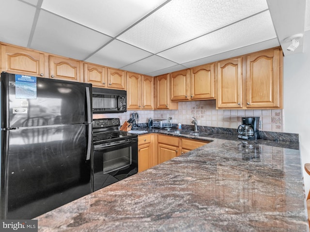 107 Convention Center Dr Unit 1410D, Ocean City, MD 21842 - kitchen with black appliances, dark stone counters, tasteful backsplash, and a paneled ceiling