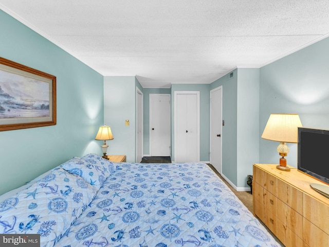 107 Convention Center Dr Unit 1410D, Ocean City, MD 21842 - bedroom with carpet floors, ornamental molding, and a textured ceiling