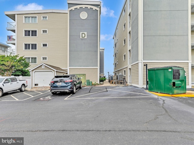 107 Convention Center Dr Unit 1410D, Ocean City, MD 21842 - view of building exterior with uncovered parking
