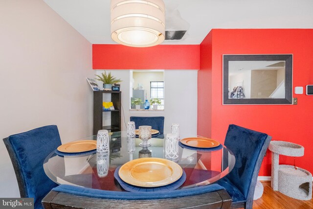 6571 Ronald Rd, Capitol Heights, MD 20743 - dining room featuring baseboards and wood finished floors