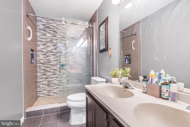 6571 Ronald Rd, Capitol Heights, MD 20743 - full bathroom with a tile shower, double vanity, and tile patterned flooring