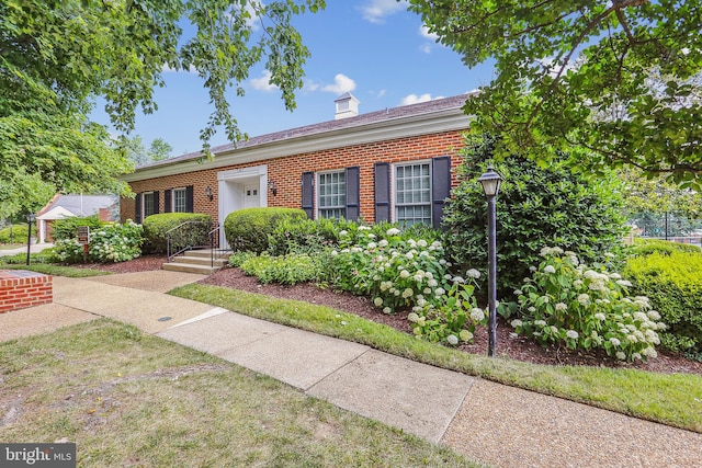 2806 S Abingdon St Unit A, Arlington, VA 22206 - view of front of property with brick siding and a chimney