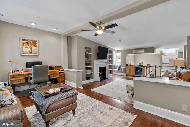 1518 Mount Vernon St Unit 3, Philadelphia, PA 19130 - living room featuring beverage cooler, an AC wall unit, ceiling fan, wood finished floors, and built in features