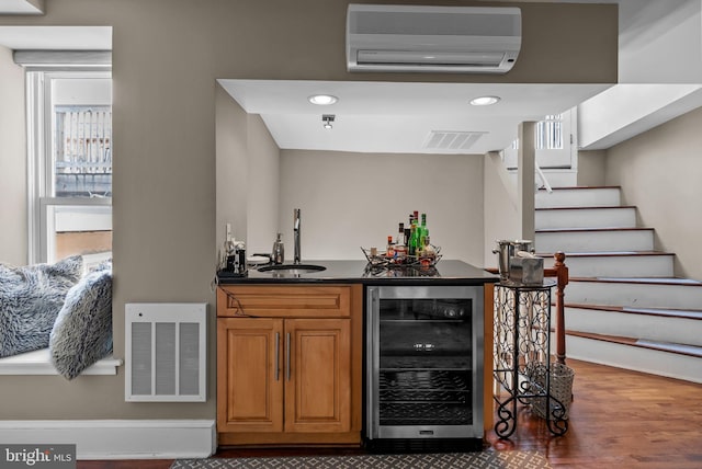 1518 Mount Vernon St Unit 3, Philadelphia, PA 19130 - indoor wet bar featuring beverage cooler, a wall unit AC, stairs, wood finished floors, and recessed lighting