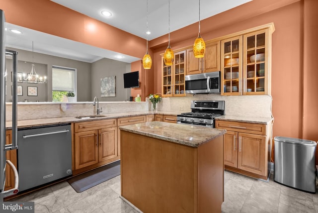 1518 Mount Vernon St Unit 3, Philadelphia, PA 19130 - kitchen featuring appliances with stainless steel finishes, tasteful backsplash, light stone counters, a peninsula, and recessed lighting