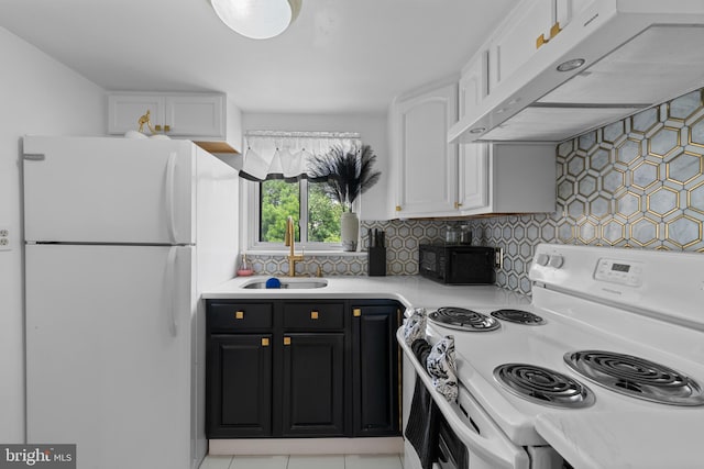 8030 Ditman St Unit 138X, Philadelphia, PA 19136 - kitchen with white appliances, under cabinet range hood, white cabinetry, light countertops, and dark cabinetry