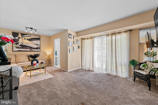 8030 Ditman St Unit 138X, Philadelphia, PA 19136 - carpeted living area featuring rail lighting and baseboards