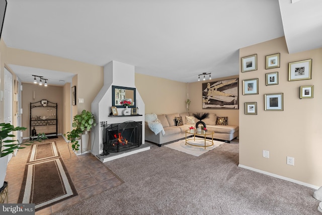 8030 Ditman St Unit 138X, Philadelphia, PA 19136 - carpeted living area with track lighting and a multi sided fireplace