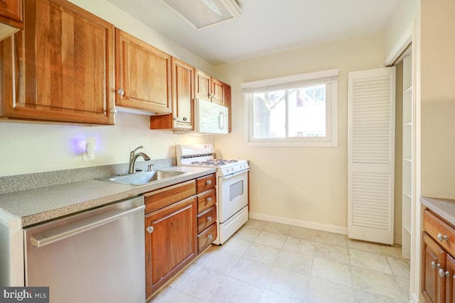 53 Skyhill Rd Unit 204, Alexandria, VA 22314 - kitchen with white appliances, light countertops, and brown cabinetry