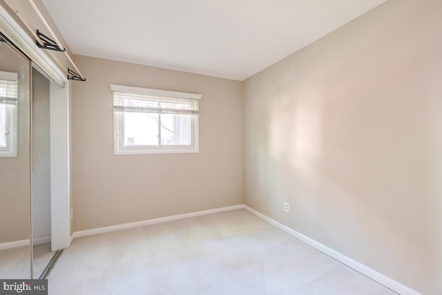 53 Skyhill Rd Unit 204, Alexandria, VA 22314 - unfurnished bedroom featuring light carpet and a closet