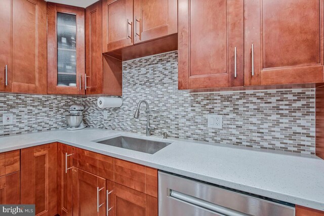 6614 Mccahill Dr, Laurel, MD 20707 - kitchen with dishwasher, glass insert cabinets, backsplash, and light stone countertops