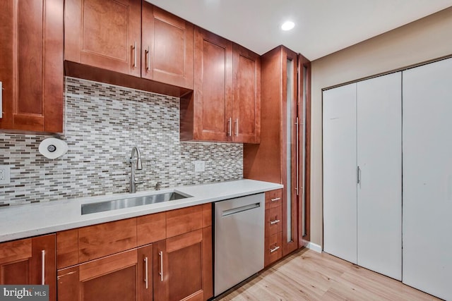 6614 Mccahill Dr, Laurel, MD 20707 - kitchen featuring dishwasher, light wood-type flooring, light countertops, tasteful backsplash, and recessed lighting